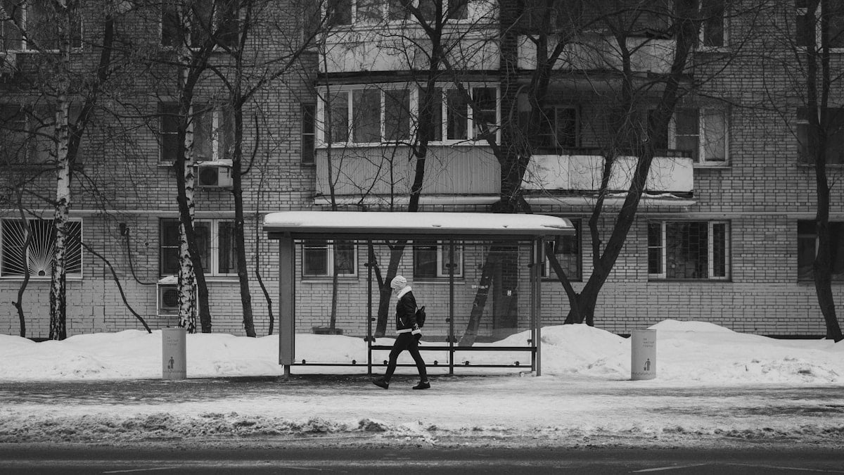 Bus stop on the background of an apartment building.
